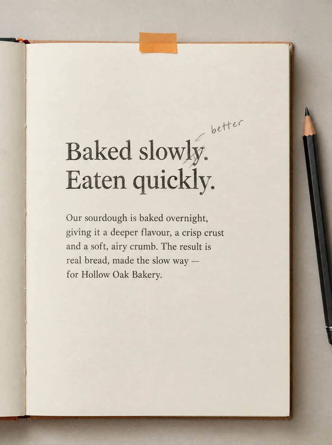 A headline proof reading “Baked slowly. Eaten quickly.” with a pencil edit and an amber sticky tab.